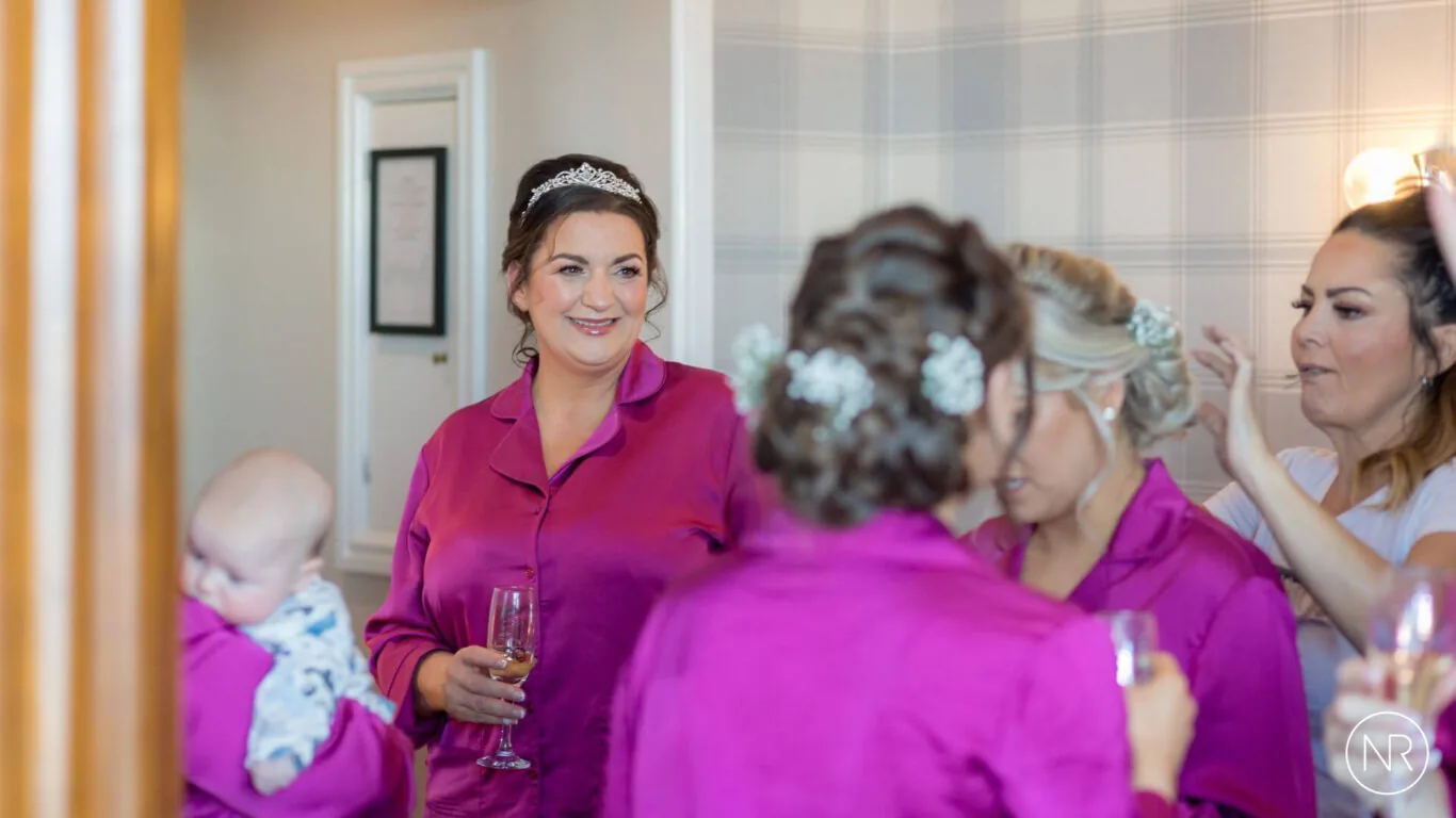 Nathan-Roberts-bride-and-bridesmaid-getting-ready-logo