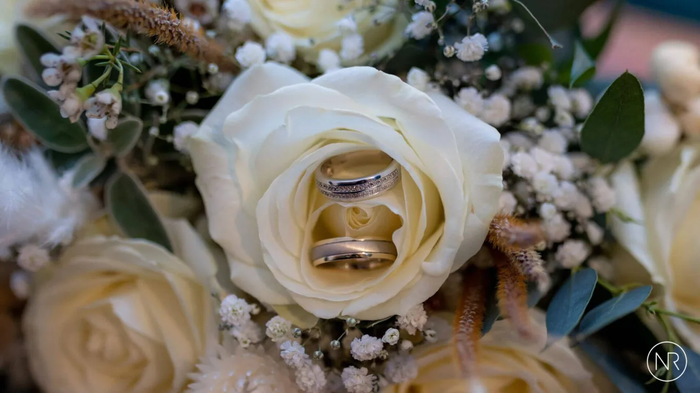 Nathan-Roberts-wedding-rings-in-the-bouquet-logo